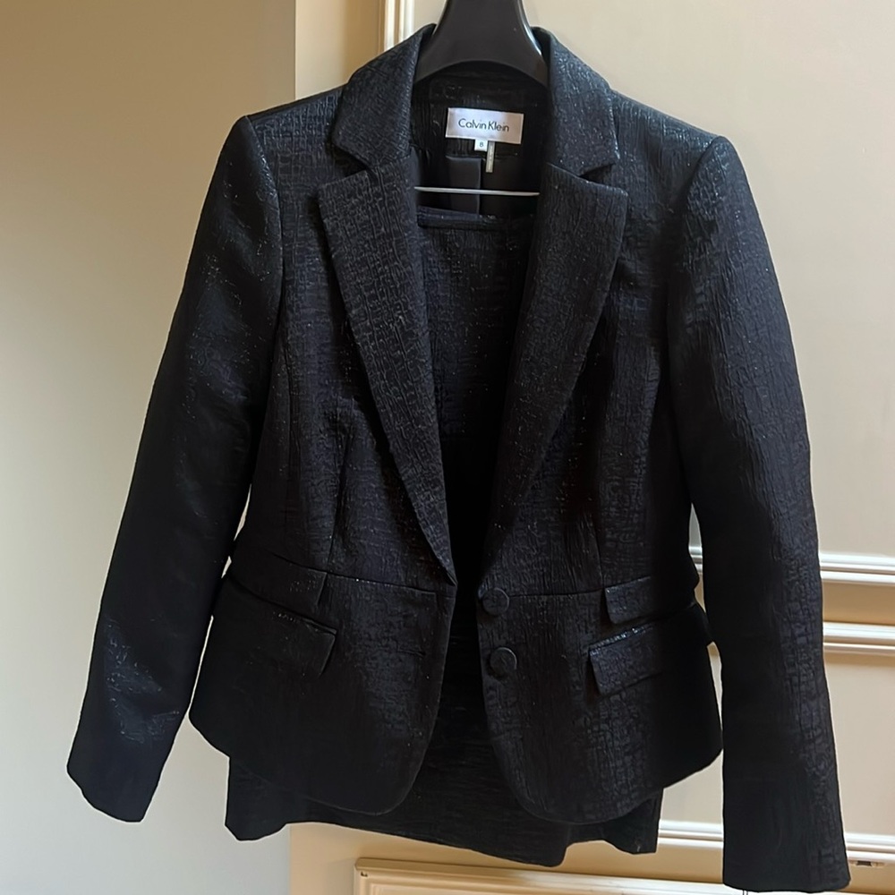 Beautiful black dressy suit.  Perfect for an evening wedding! Never been worn.